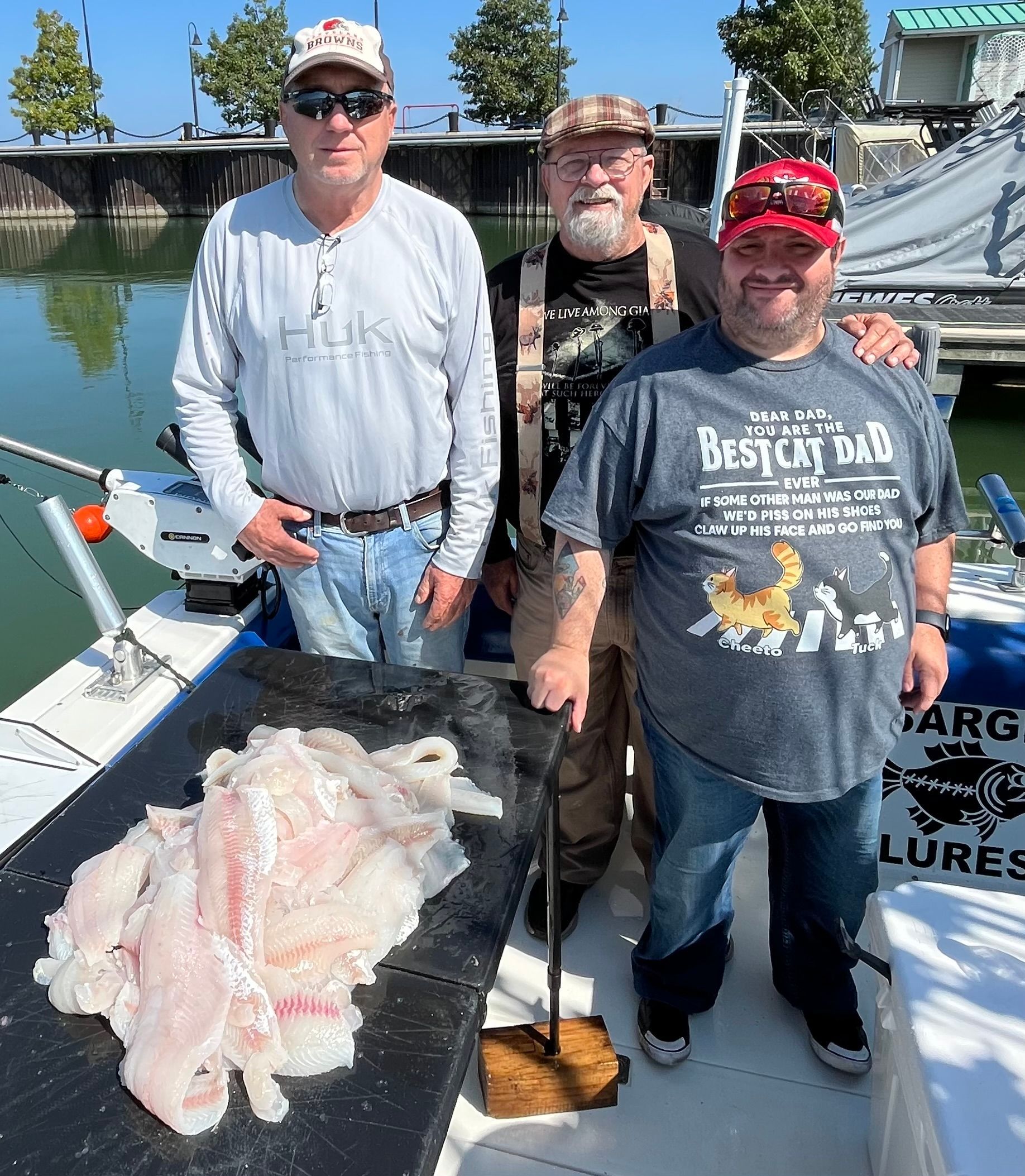 Group on Lake Erie anglers standing with their filleted catch with Sir Walleye Charters