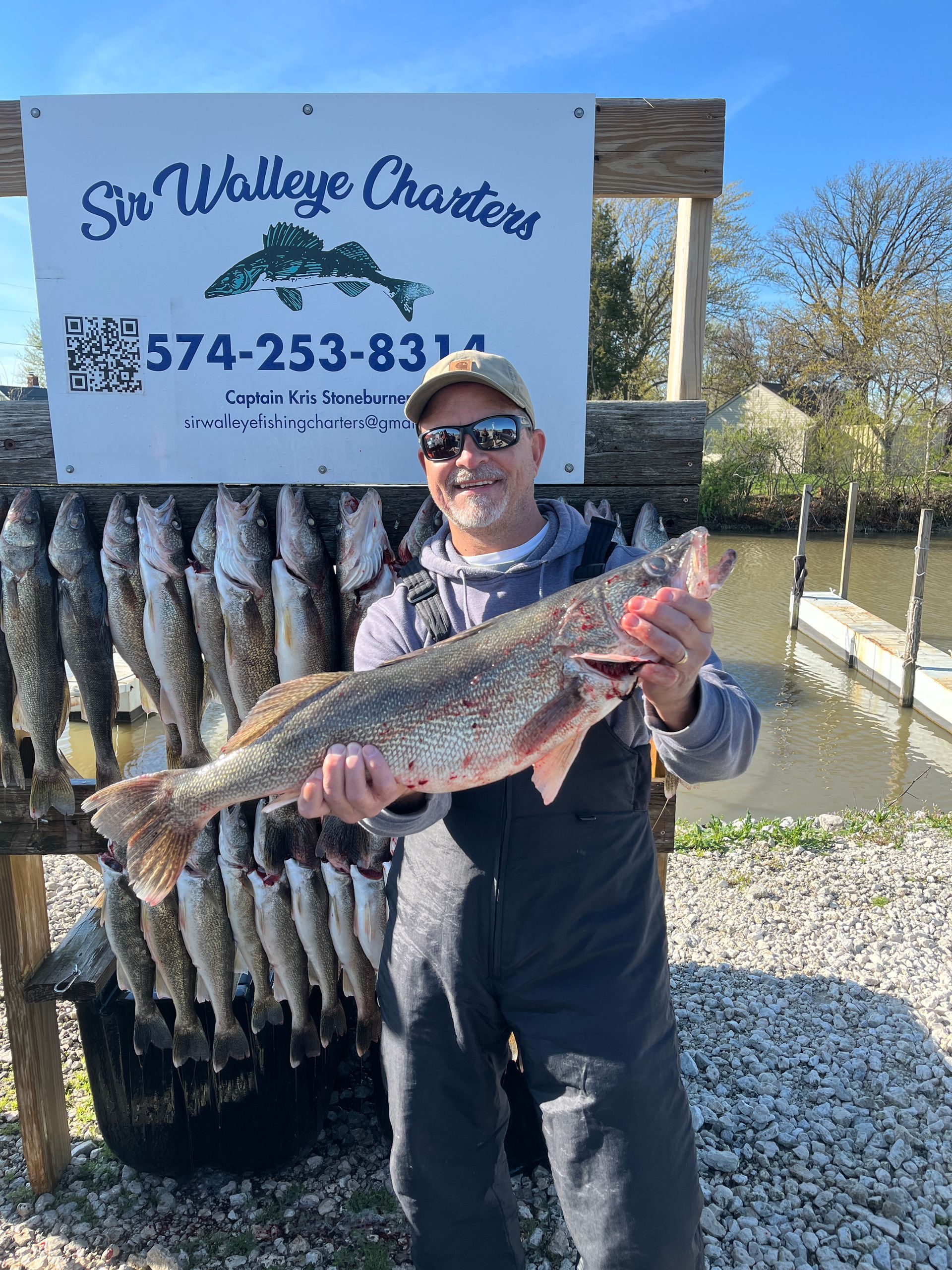 Picture of angler holding a 29.5 inch Fish Ohio walleye caught with Sir Walleye Charters. 