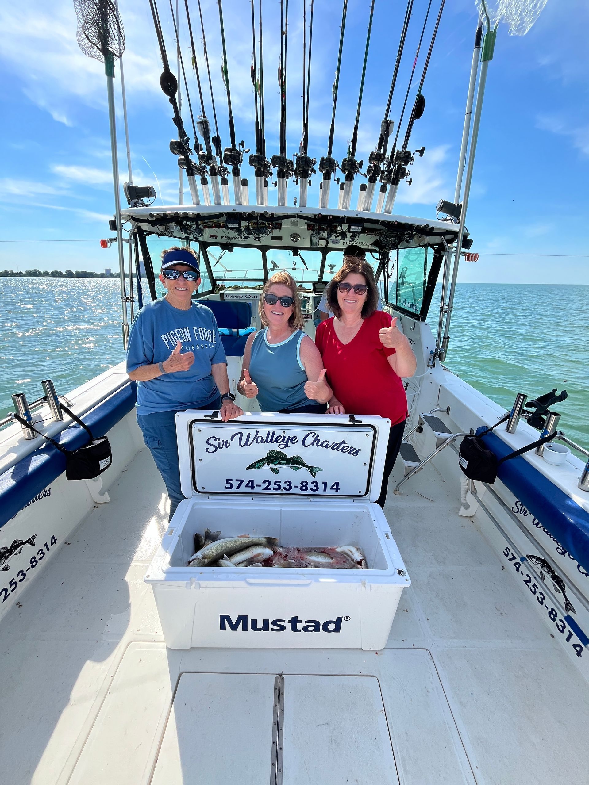 Image of a Ladies charter with Sir Walleye and a full limit of Lake Erie walleyes.
