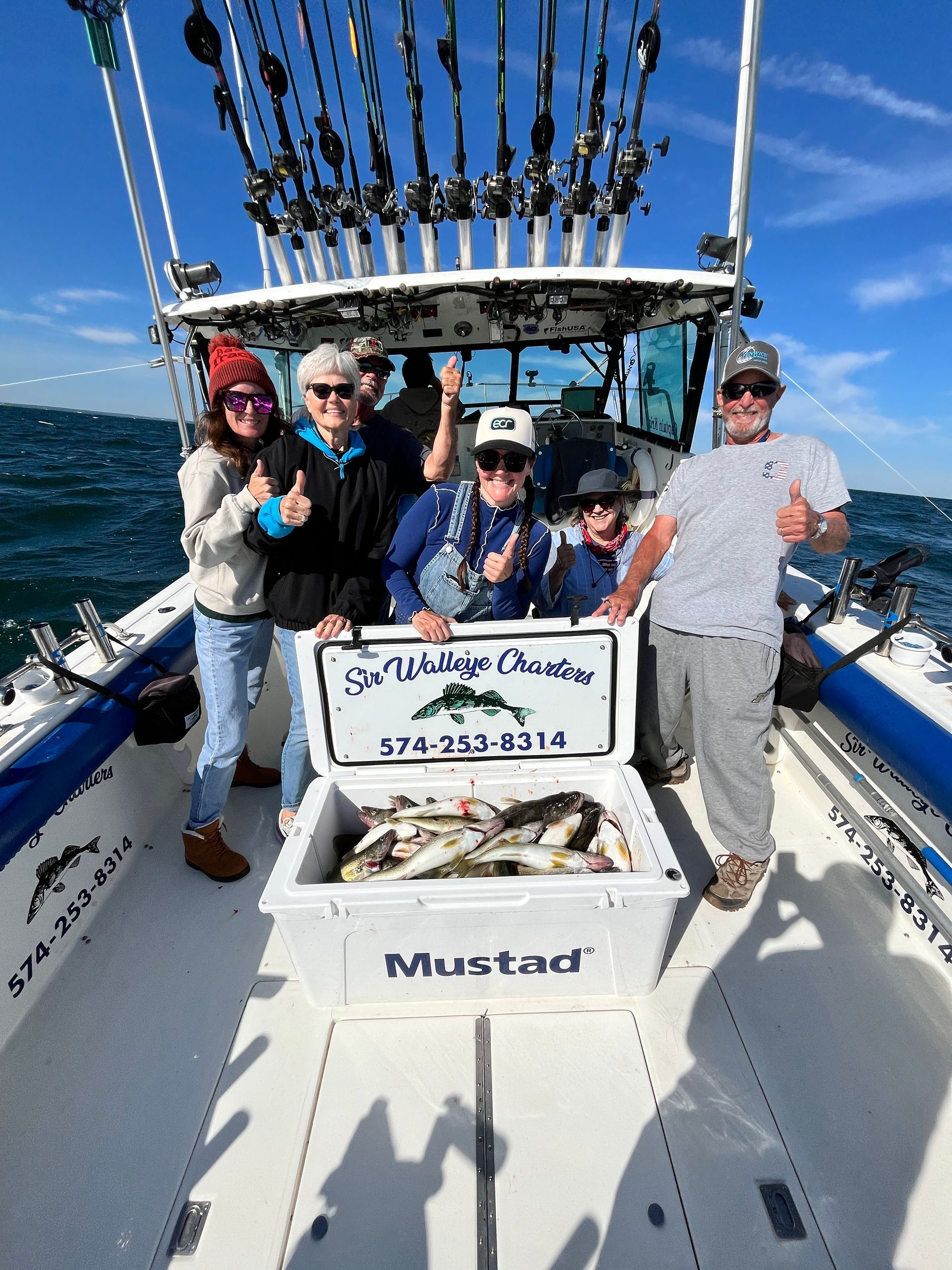 Family group with a cooler full of Lake Erie Walleyes.