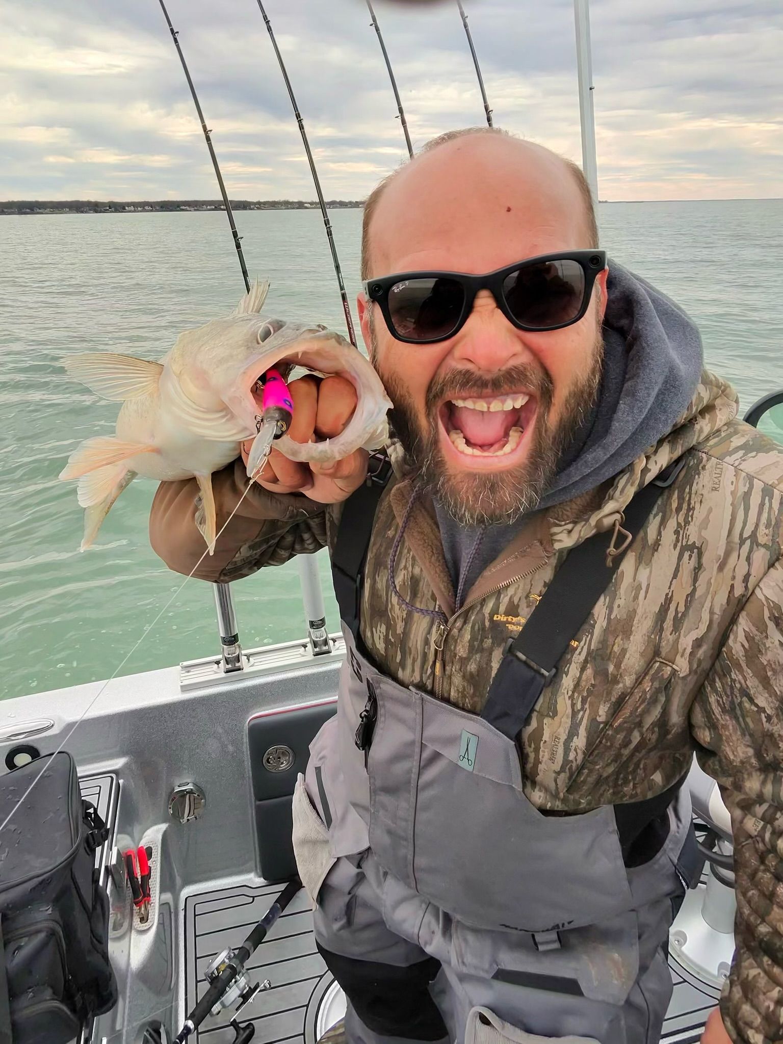 Captain Kris of Sir Walleye Charters holding a Lake Erie walleye caught trolling.