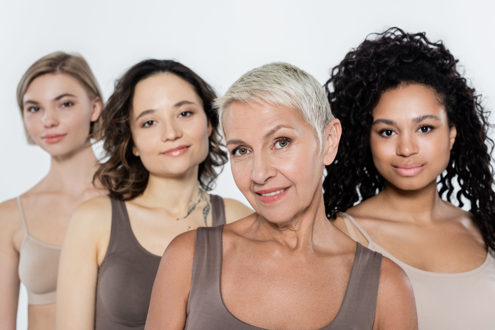 A group of women are posing for a picture together.