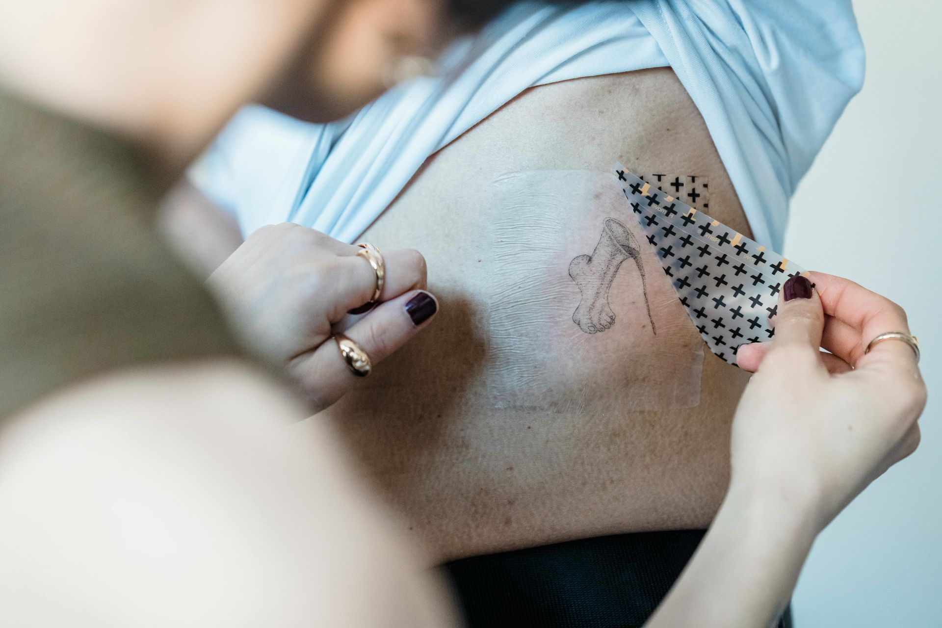Person exploring tattoo removal service options for small body tattoo