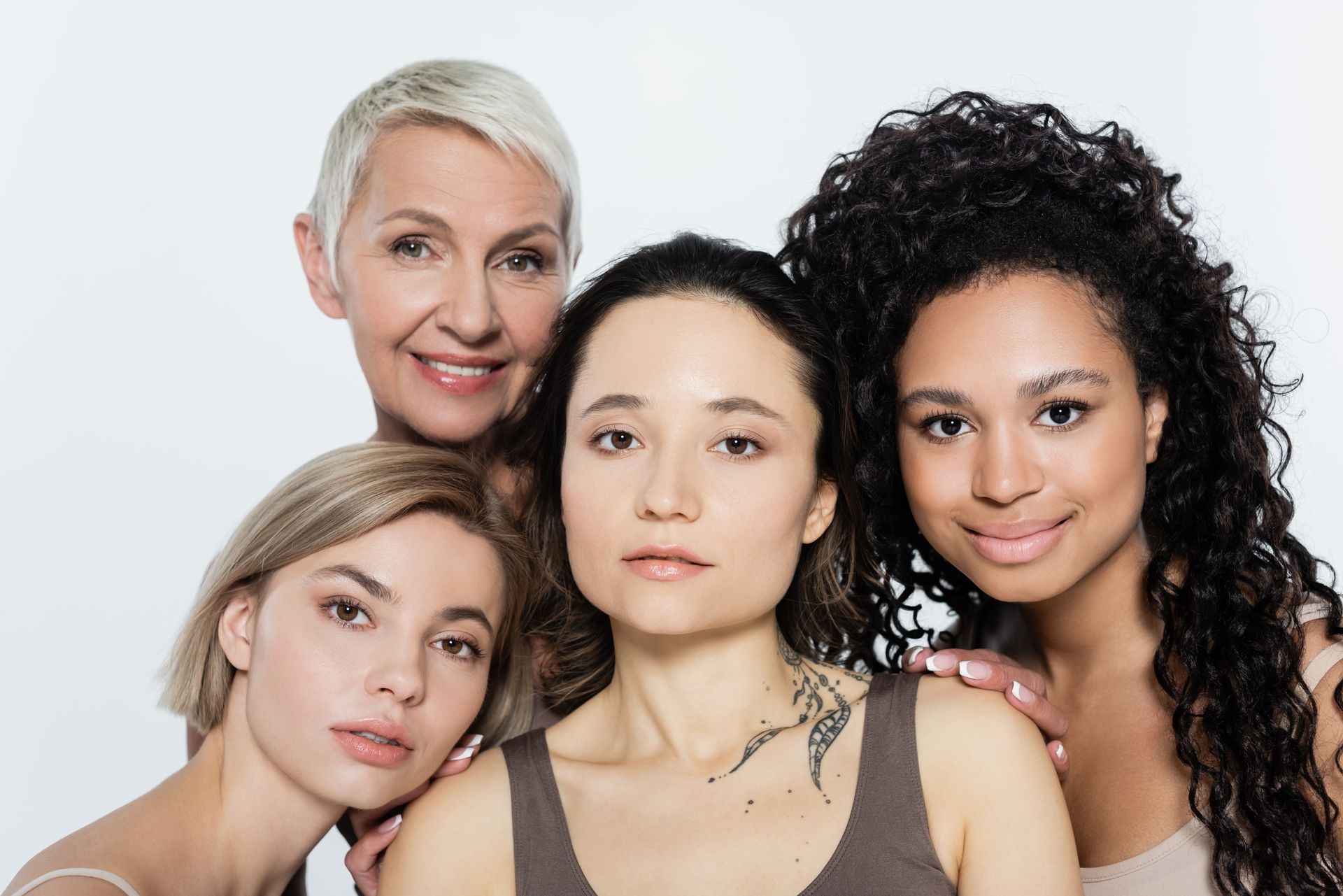 A group of women are posing for a picture together.