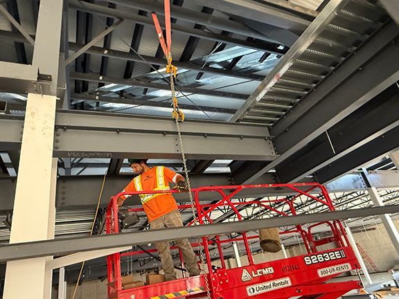 Steel I-beams support weight of second floor at Ganges building project.