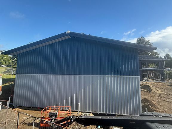 Nice end view of the grey and blue insulated metal panels.