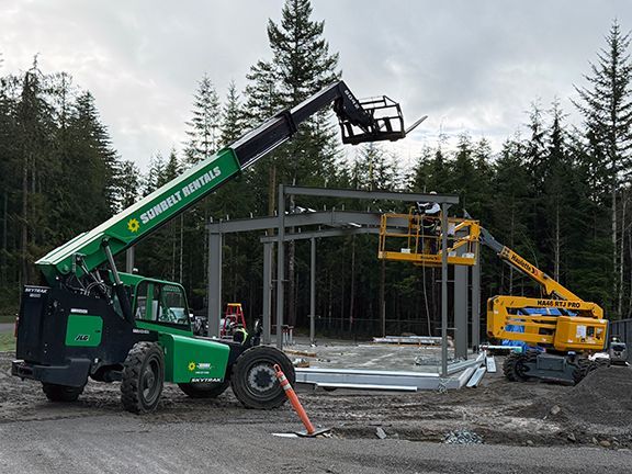 More steel beams are added to building frame.