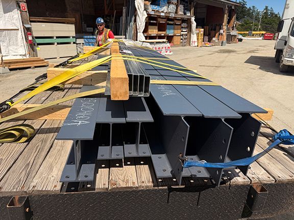 Steel I-beams delivered to building project in Ganges, BC.