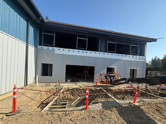 Photo #2 of building exterior, summer 2025.