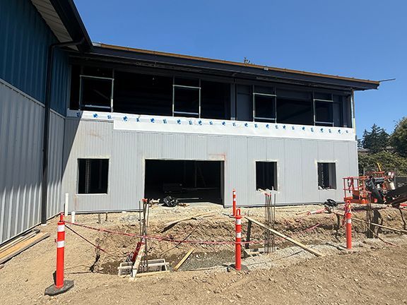 Photo #1 of building exterior, summer 2025.