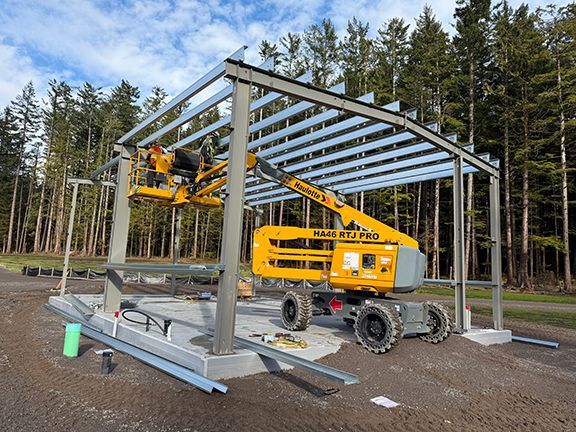 Building framing nearing completion at cemetery building site.