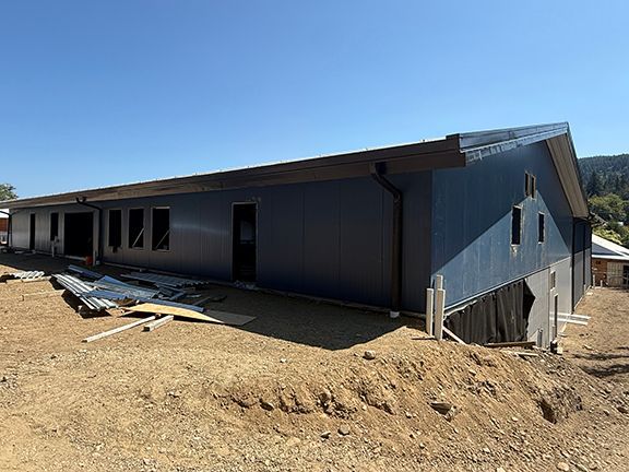 View of the Windsor Plywood Ganges PEMB structure from top of hill.