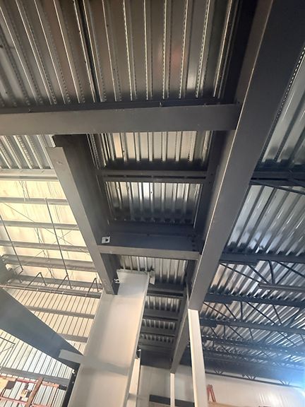 Closeup of the i-beams supporting the second floor and the floor panels.