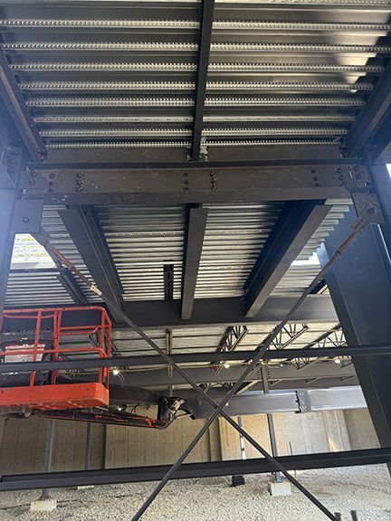 Steel supports and beams seen from underneath at BC construction building project.