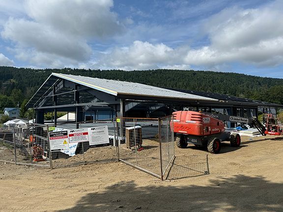 View of metal building framing under construction.