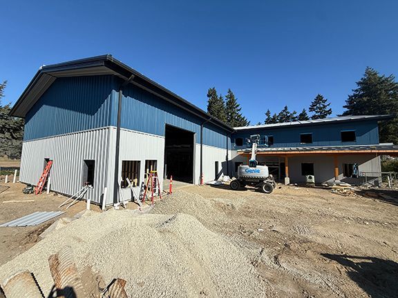 Second front part of metal building at Windsor Plywood construction in BC.
