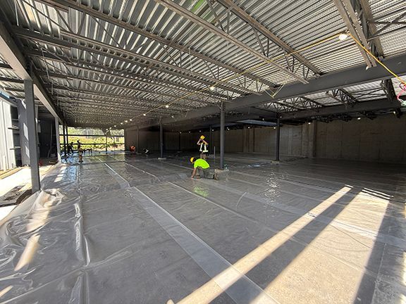 Construction crews prepare for concrete at Windsor Plywood construction project.