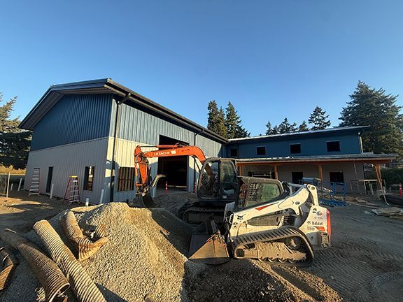 Front view of the metal building being installed for Windsor Plywood at Ganges, BC.