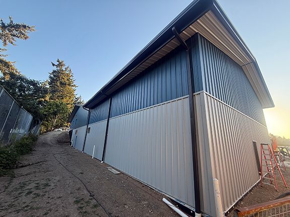 Back corner view of the metal wall panels used at Windsor Plywood building at Ganges, BC.
