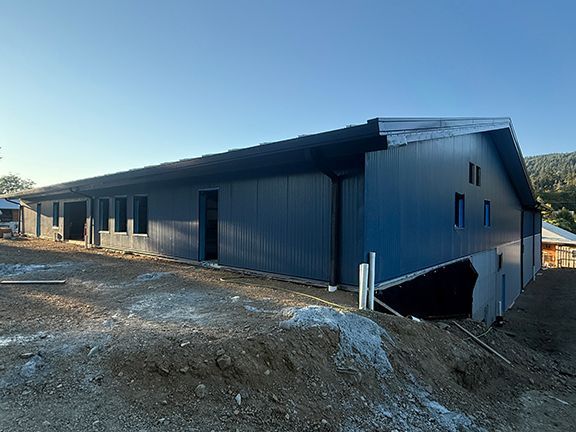 End view of the metal building under construction in Ganges, BC.