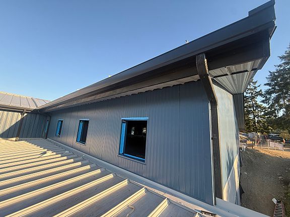 Second floor window and roof panel at Windsor Plywood in Ganges, BC.