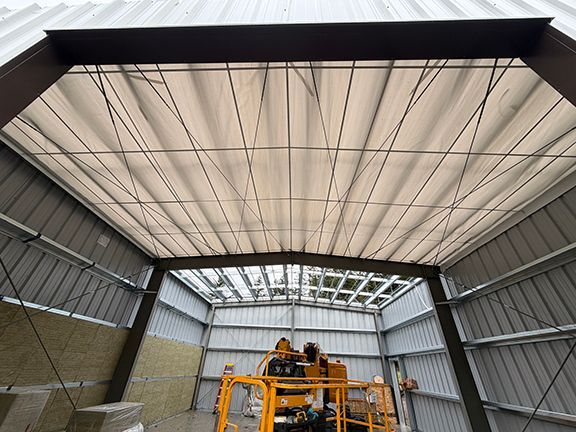 Interior look of building structure as insulation gets added to walls.