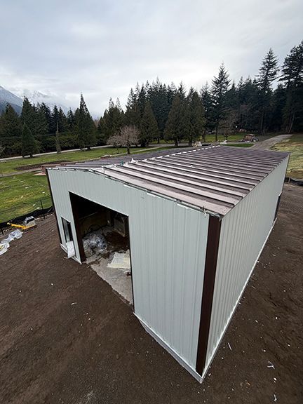 Metal roofing panels added to top of structure, showing how they fit in with location.