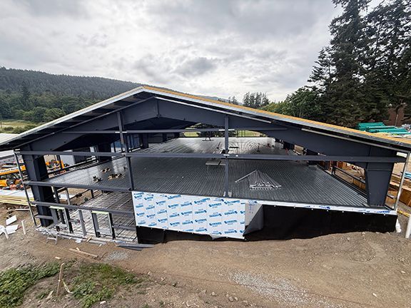 View of metal framing supporting a mezzanine at Salt Spring Island building project.