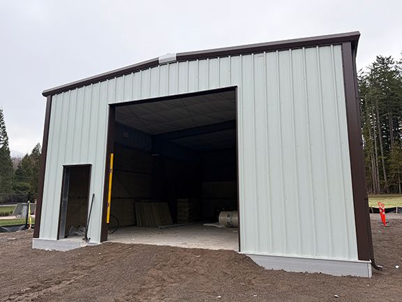 Pre-engineered metal building design allows for large doorways and plenty of storage.