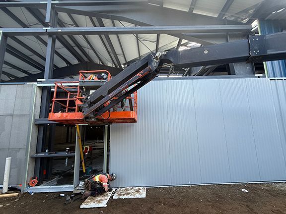 Team adds metal wall panels to commercial building project in Ganges, B.C.