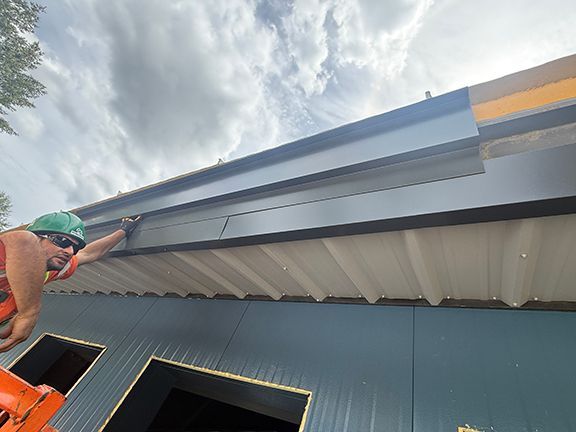 Soffits being added to roofing system on Salt Spring Island.