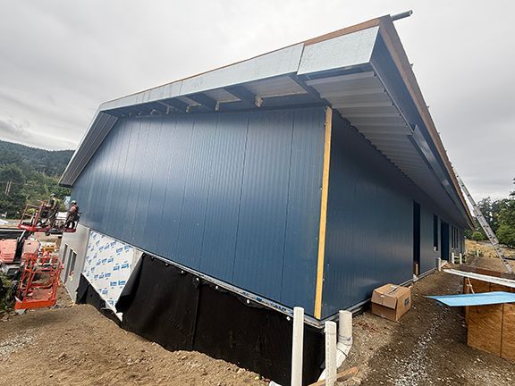Commercial metal building under construction in British Columbia.