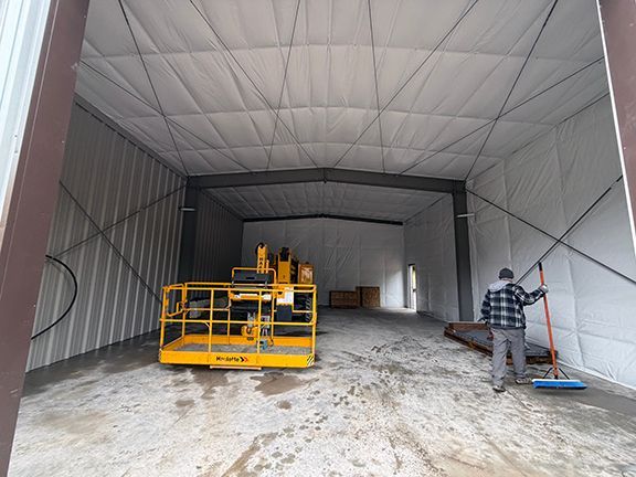 Interior view of the building as tradespeople clean up the site.