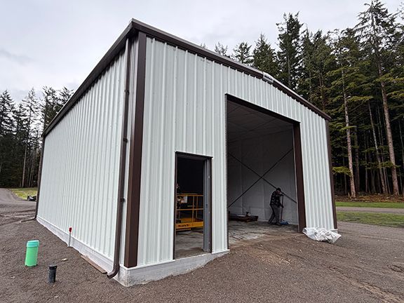 Side view of storage building with insulation added, but before doors completed.