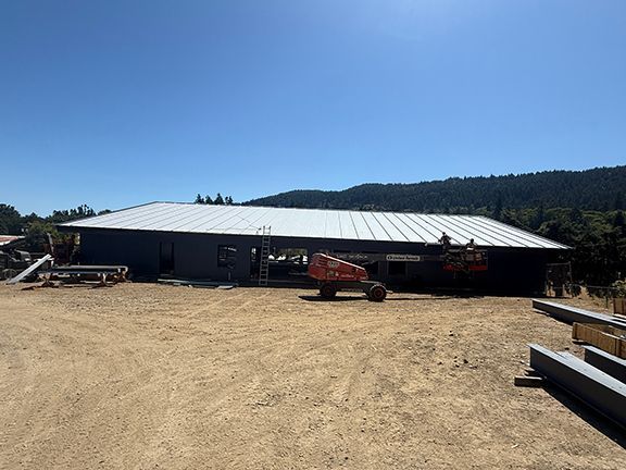 Metal buildings use engineering to create large structures with minimal columns.