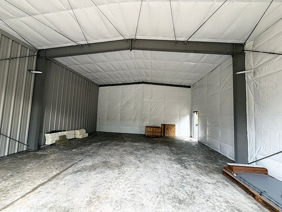 Wide open interior space of a metal building project in Squamish, B.C.