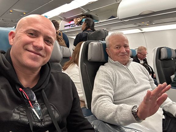 Frank Melo and his father, Benjamin, aboard their flight to the Azores.