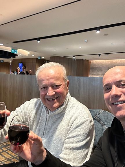 Benny Melo and Frank Melo enjoy a glass of red wine before flying to the Azores in 2024.