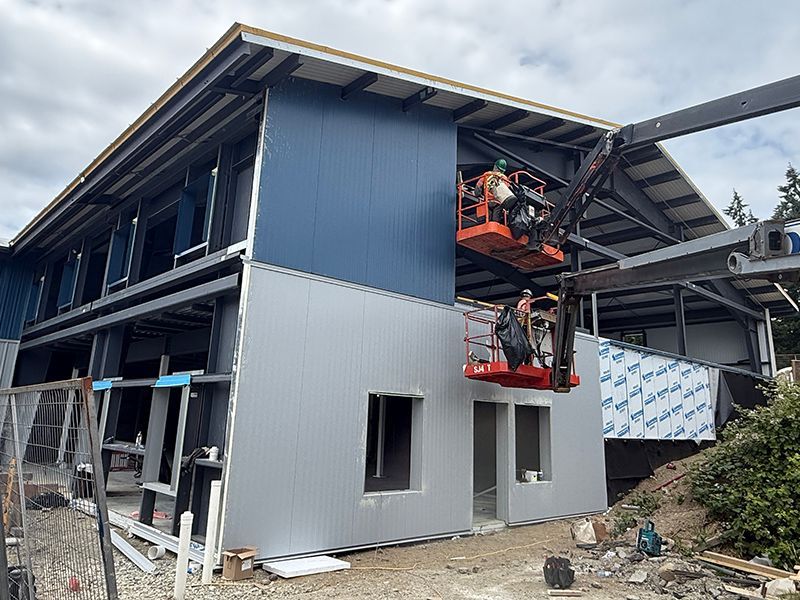 Installation of insulated metal panel to a pre-engineered metal building project in British Columbia.