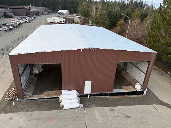 Top view of metal building showing the completed roofing system.