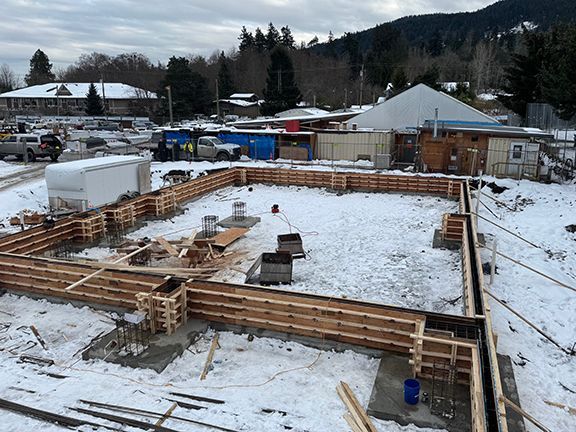 Building site plan with concrete and wood form installation in place.