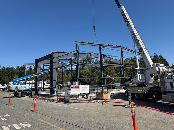 Primary framing and I-beams added to pre-engineered metal building project.