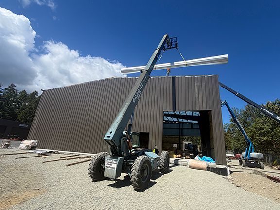 Elevator lift adds metal components to construction project in BC.