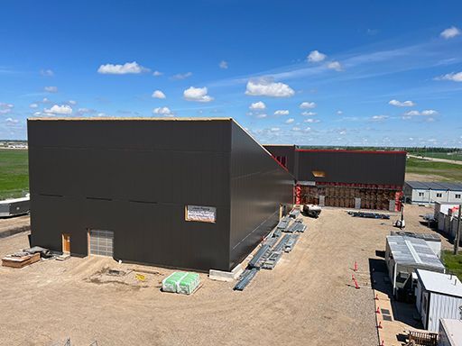 An aerial view of a large building under construction.