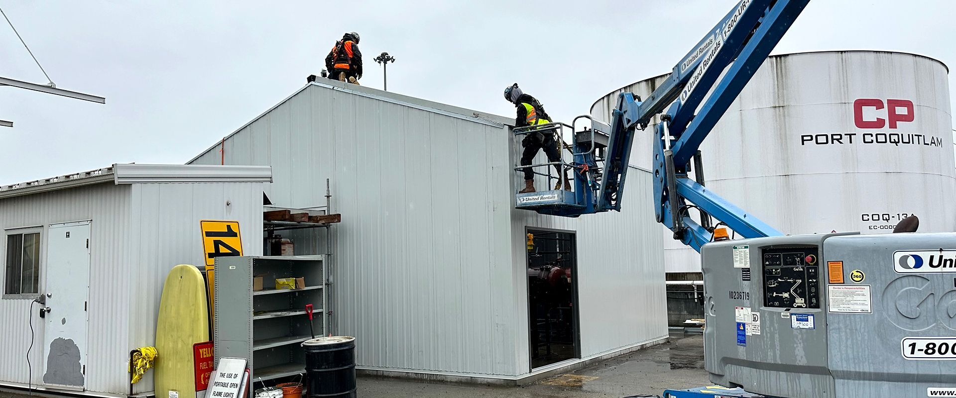 Skilled tradespeople from Double Black Construction install a fuel shed at a BC railway yard.