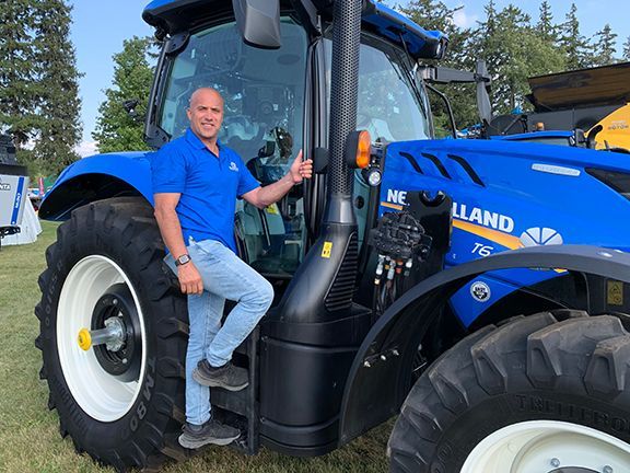 Frank Melo with a tractor at the Outdoor Farm Show in Woodstock, ON.