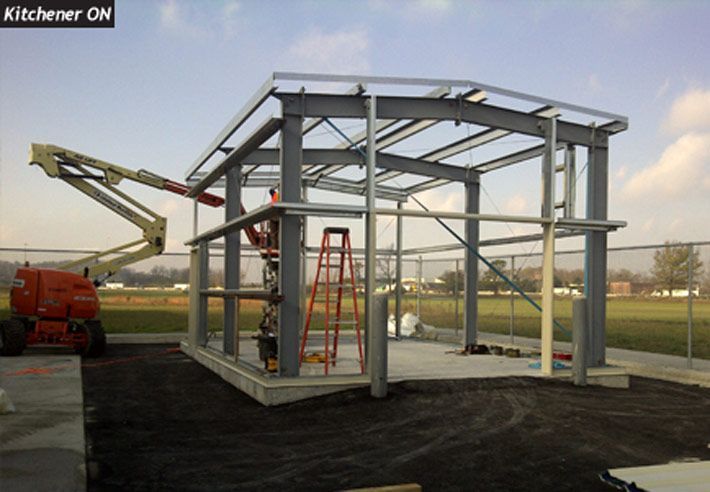 A large metal structure is being built by kitchener cn