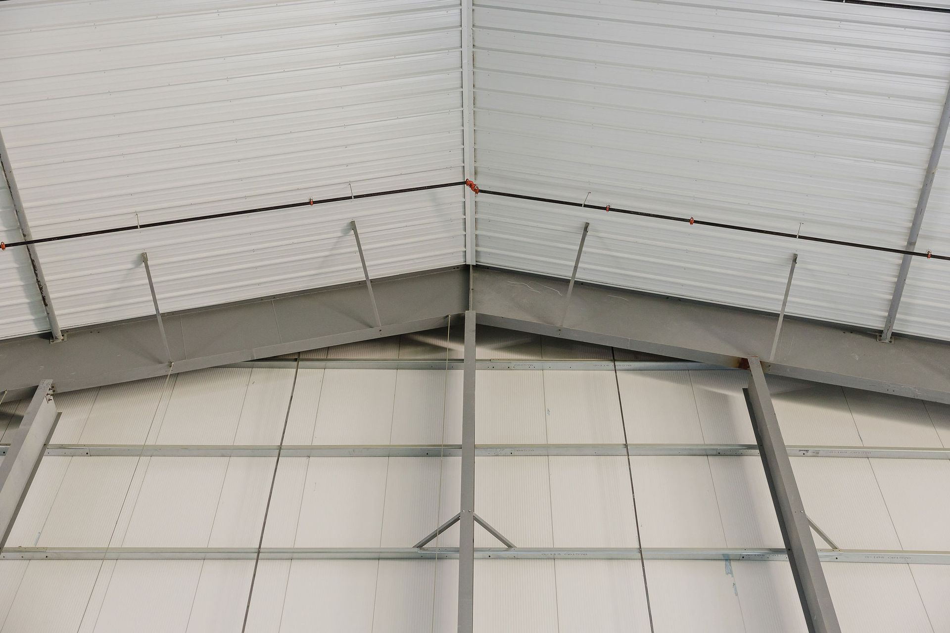 The inside of a building with a roof and a ceiling.