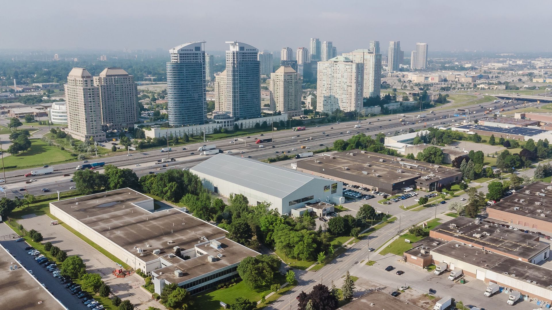 An aerial view of a city with a lot of buildings and trees.