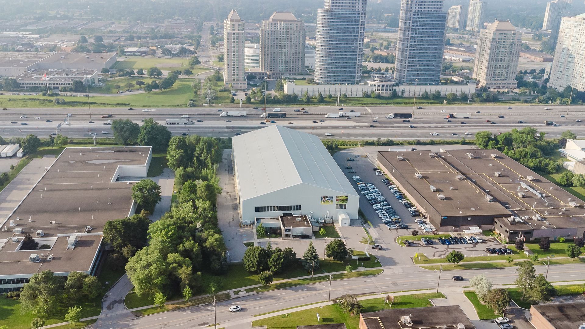 An aerial view of a large white building in the middle of a city.